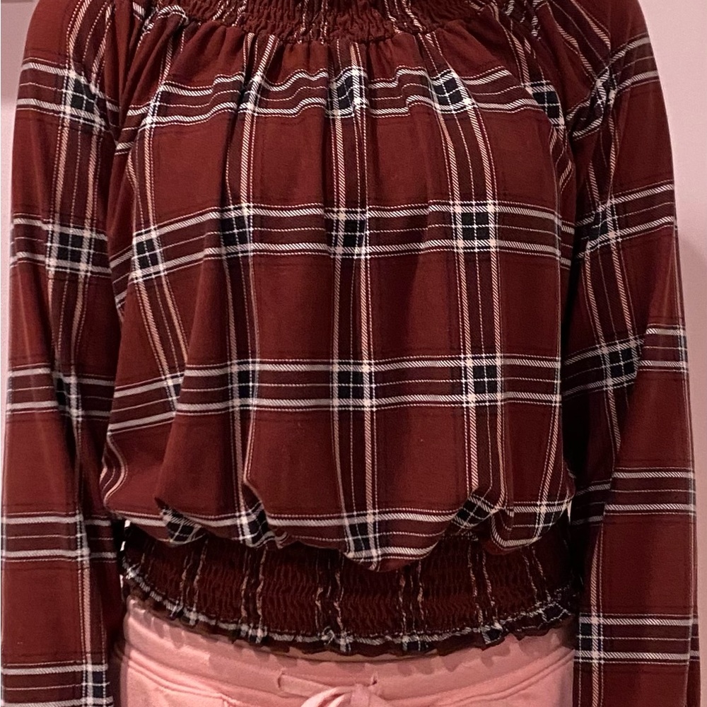Maroon plaid long sleeve blouse with a tight bottom.